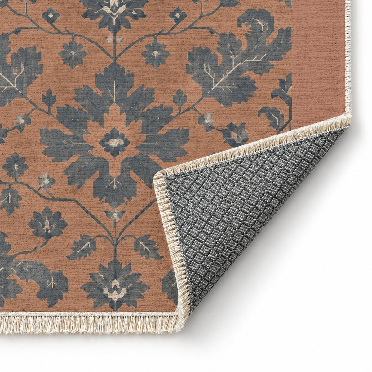 Quiet Oushak Clay & Denim washable rug folded corner showing the backing