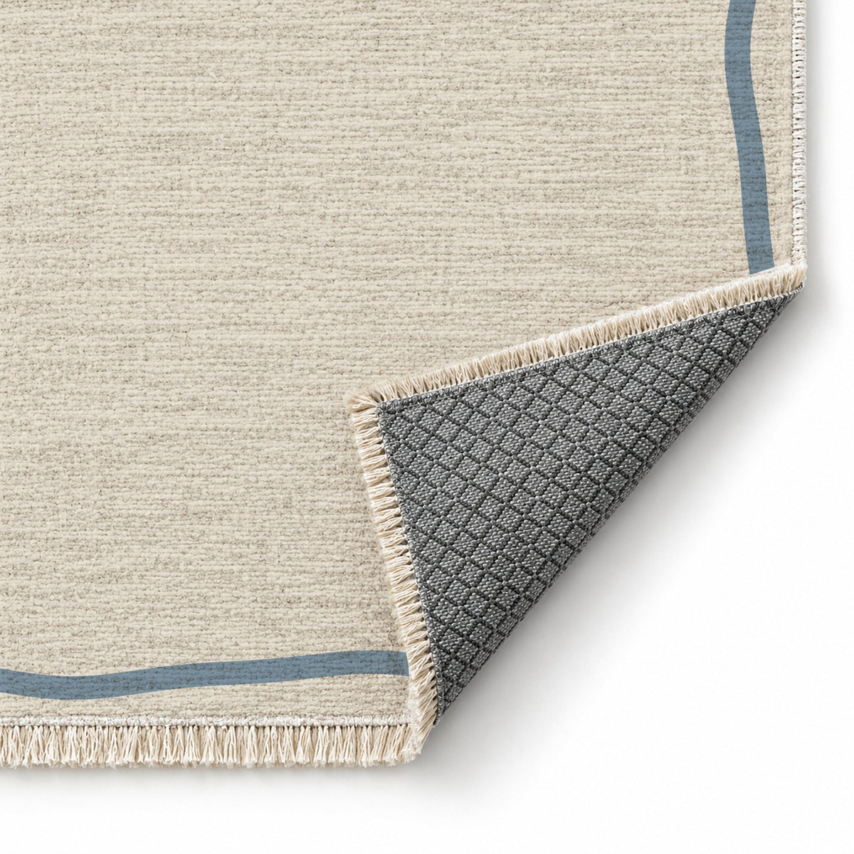 Ribbon Border Ivory & Dusty Blue washable rug folded corner showing the backing