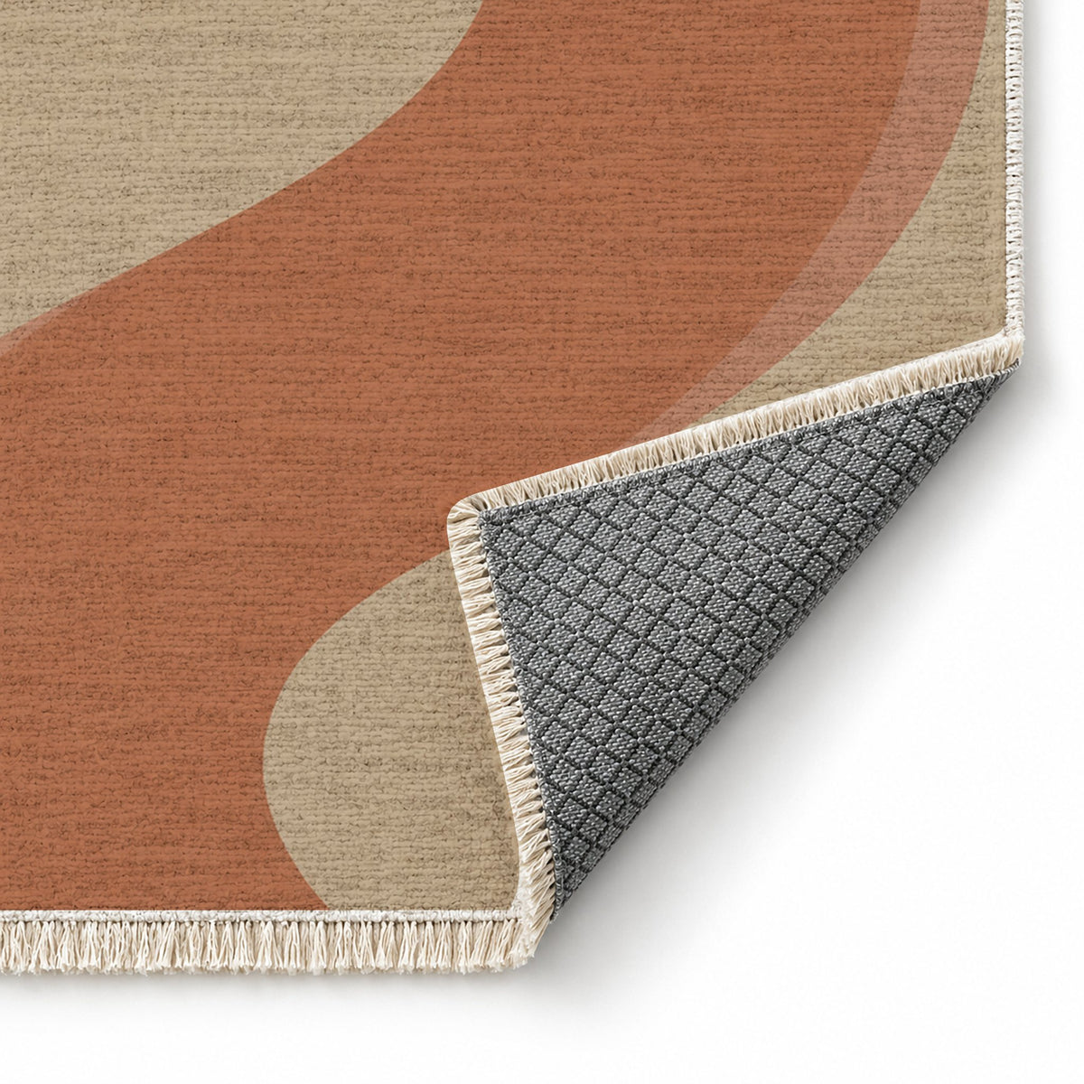 Ribbon Curve Sand & Terracotta washable rug folded corner showing the backing