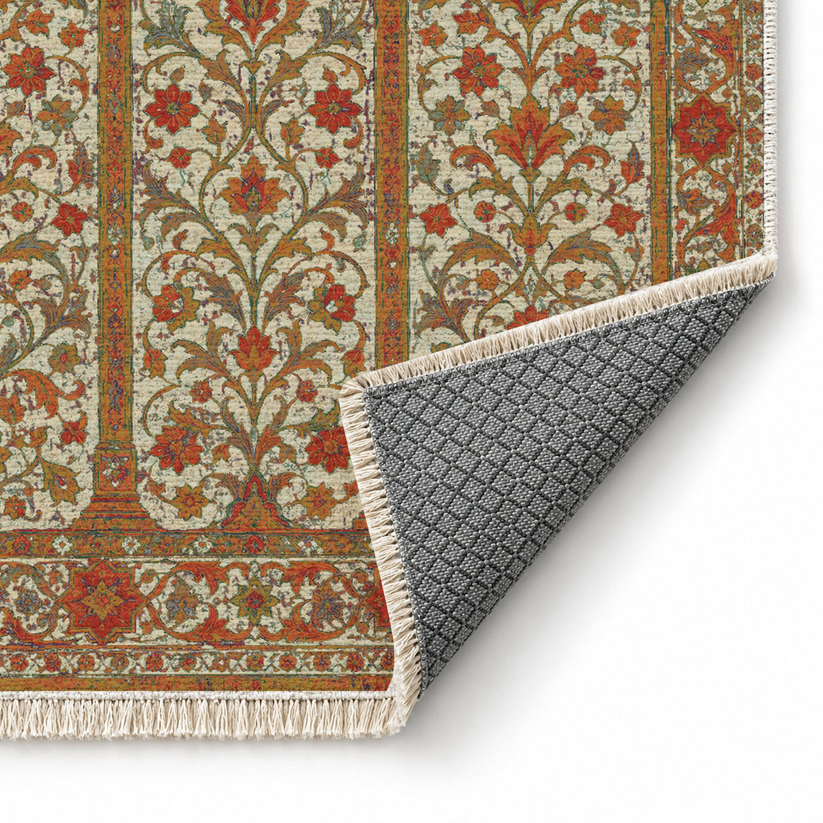 Scalloped Arcade Emerald & Terracotta washable rug folded corner showing the backing