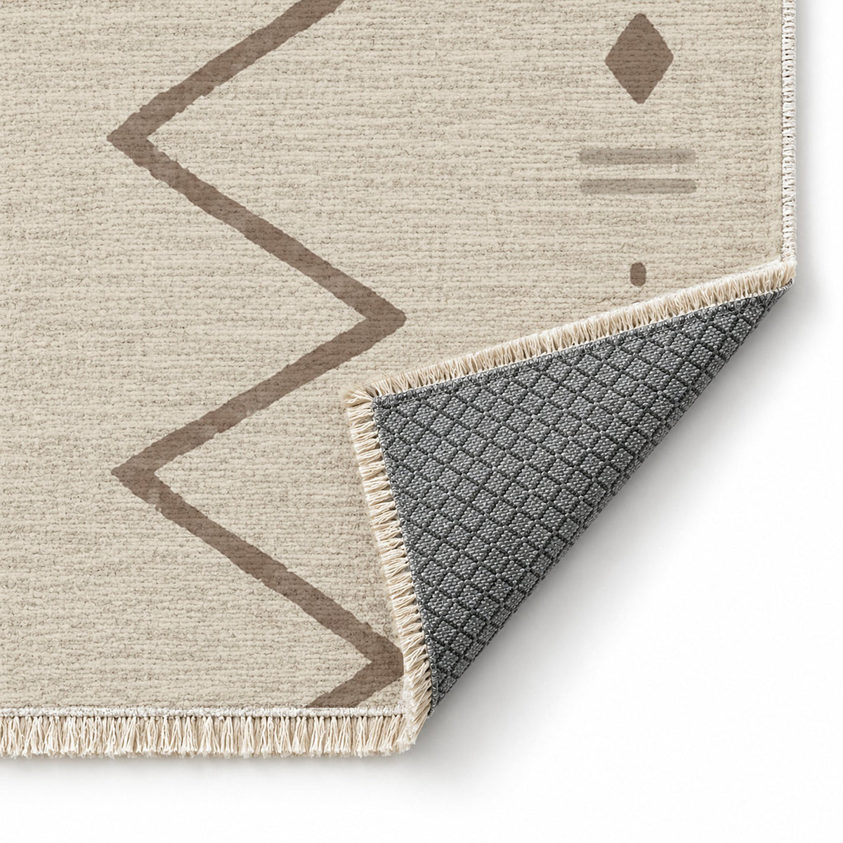 Single Path Ivory & Taupe washable rug folded corner showing the backing