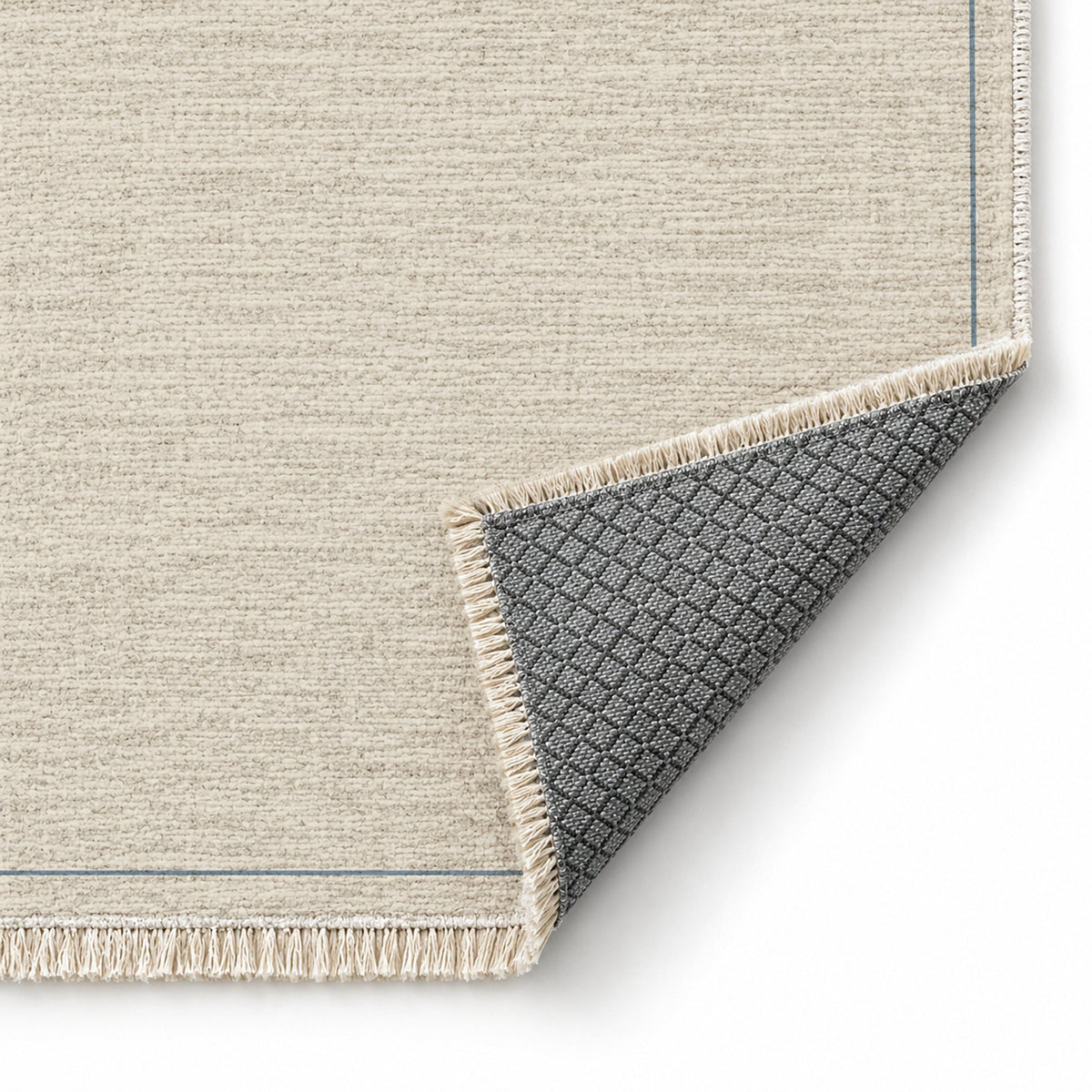 Slim Frame Ivory & Dusty Blue washable rug folded corner showing the backing