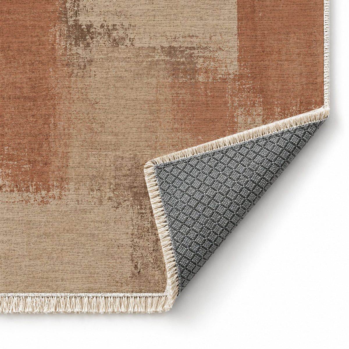 Soft Mosaic Sand & Terracotta washable rug folded corner showing the backing