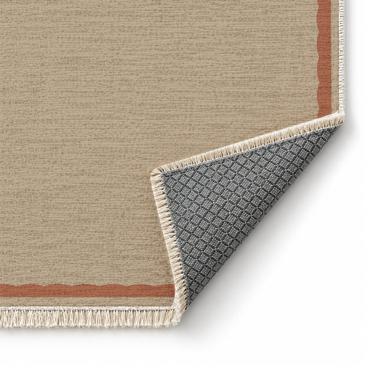 Soft Scallop Sand & Terracotta washable rug folded corner showing the backing