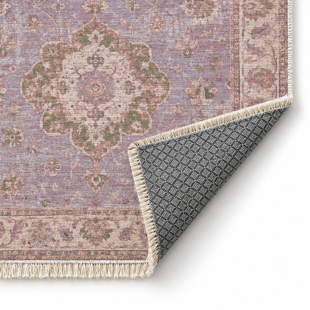 Spotted Medallions Rose & Olive washable rug folded corner showing the backing