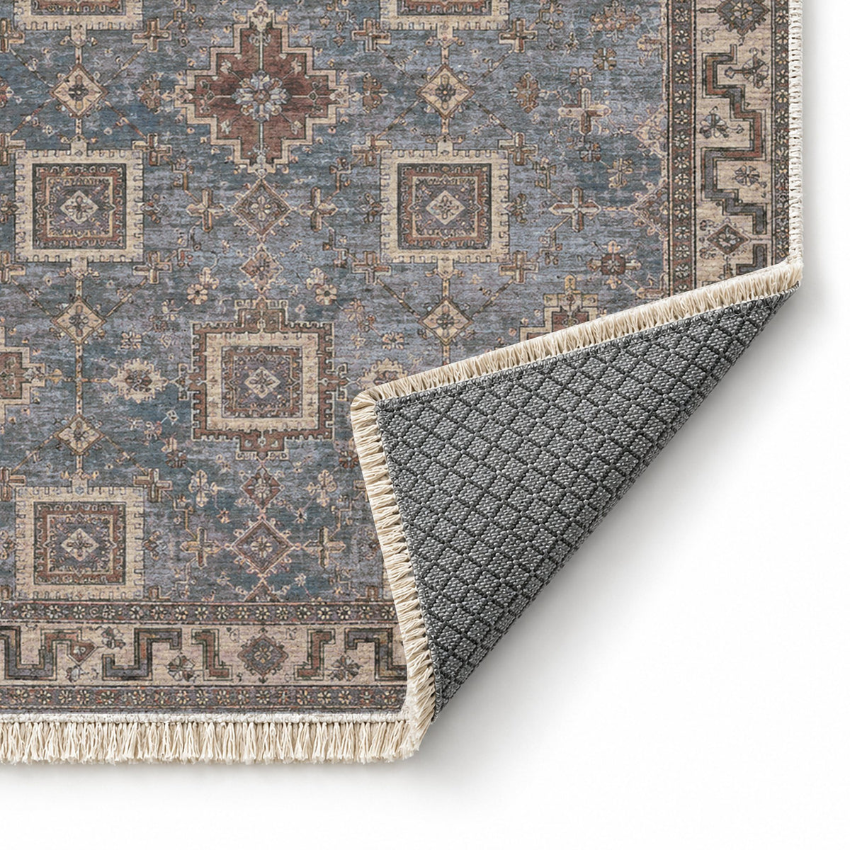 Stepped Cross Graphite & Linen washable rug folded corner showing the backing