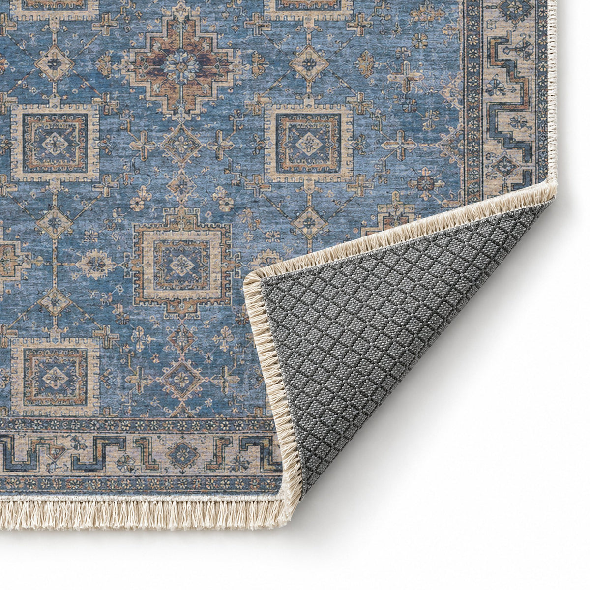 Stepped Cross Mineral Blue washable rug folded corner showing the backing