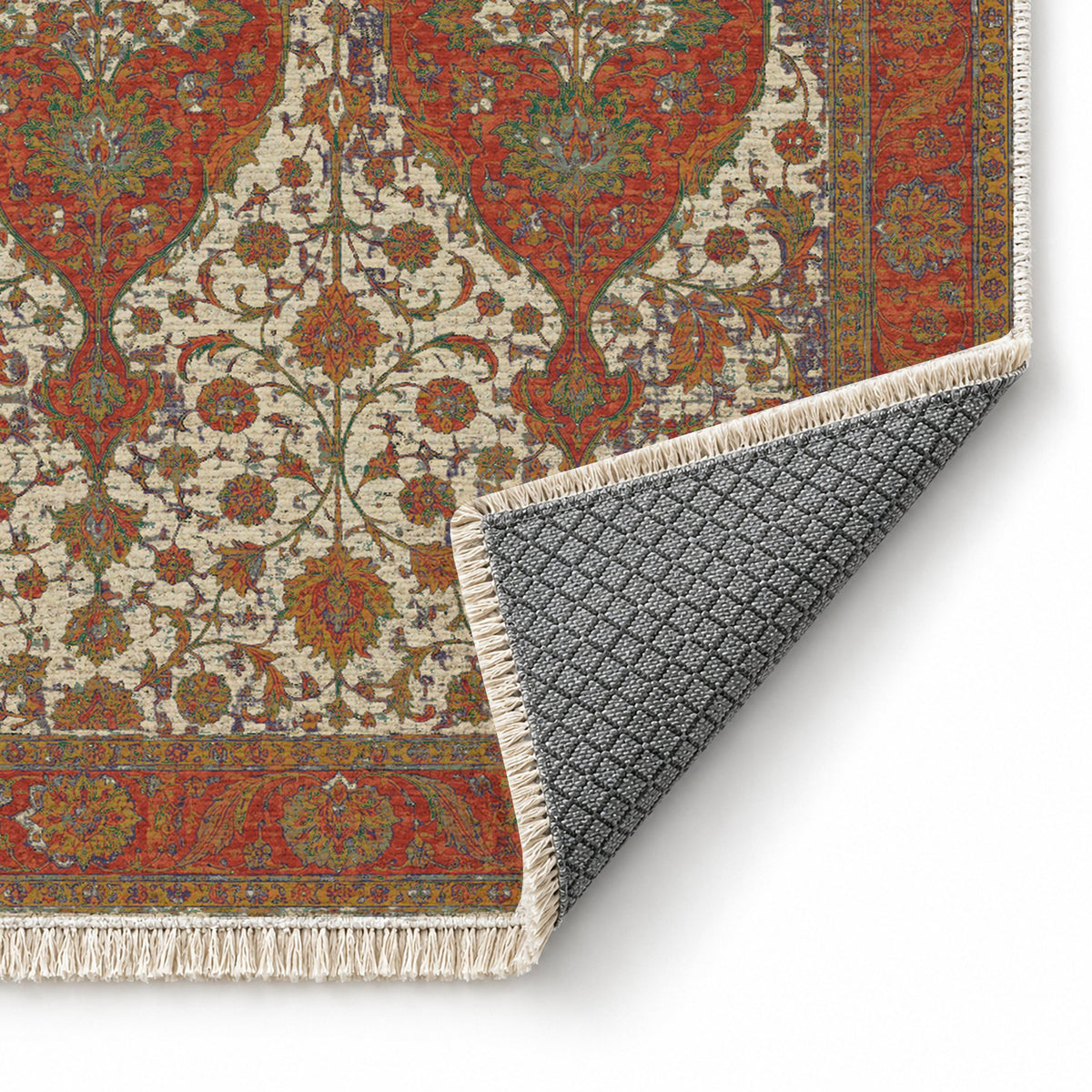 Twin Lanterns Emerald & Terracotta washable rug folded corner showing the backing