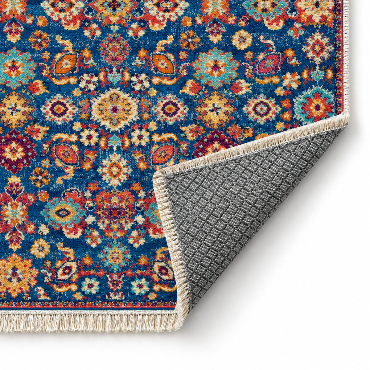 Vintage Floral 7653 Sapphire washable rug folded corner showing the backing