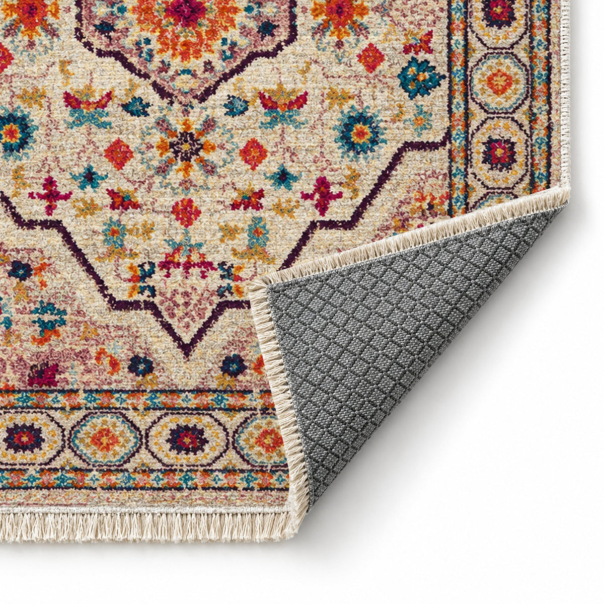 Vintage Medallion 7655 Aubergine washable rug folded corner showing the backing