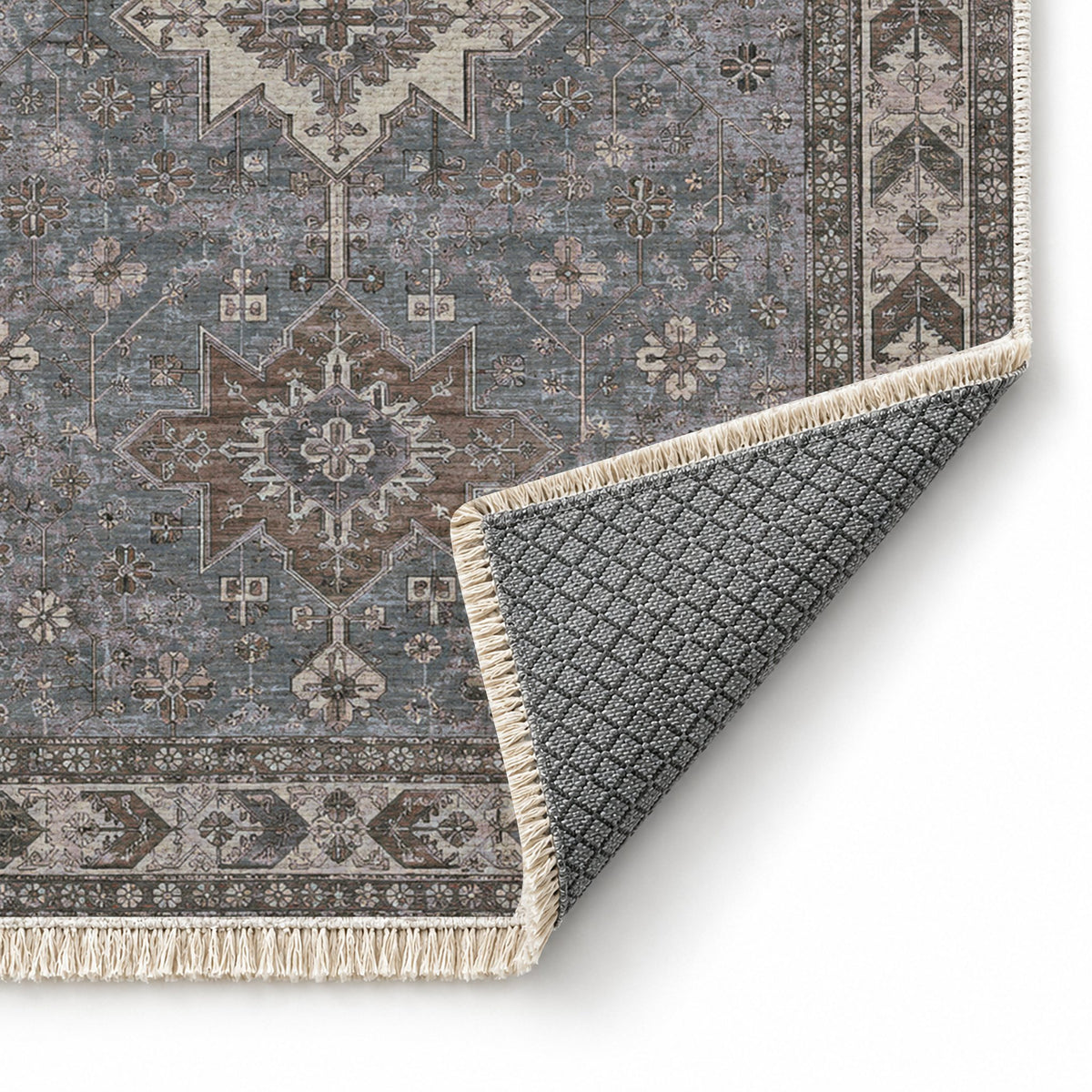 Yagcibedir Stars Graphite & Linen washable rug folded corner showing the backing