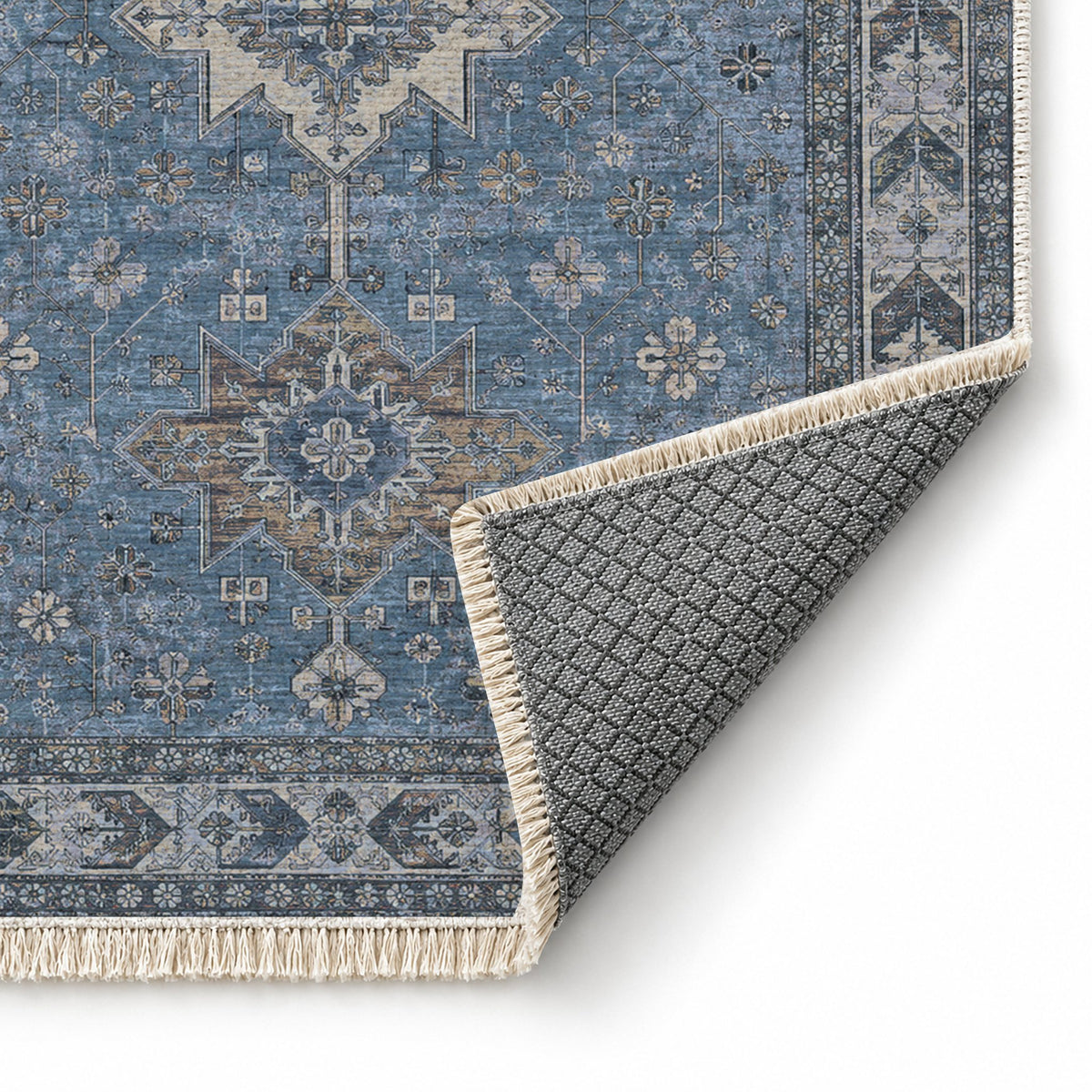 Yagcibedir Stars Mineral Blue washable rug folded corner showing the backing